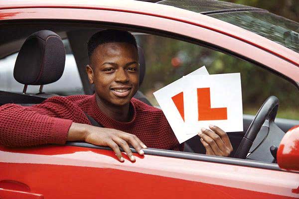 Learner driver sat in car with l-plates